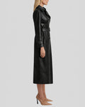 Side profile of belted black leather trench coat women