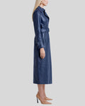 Side profile of belted blue leather long coat women