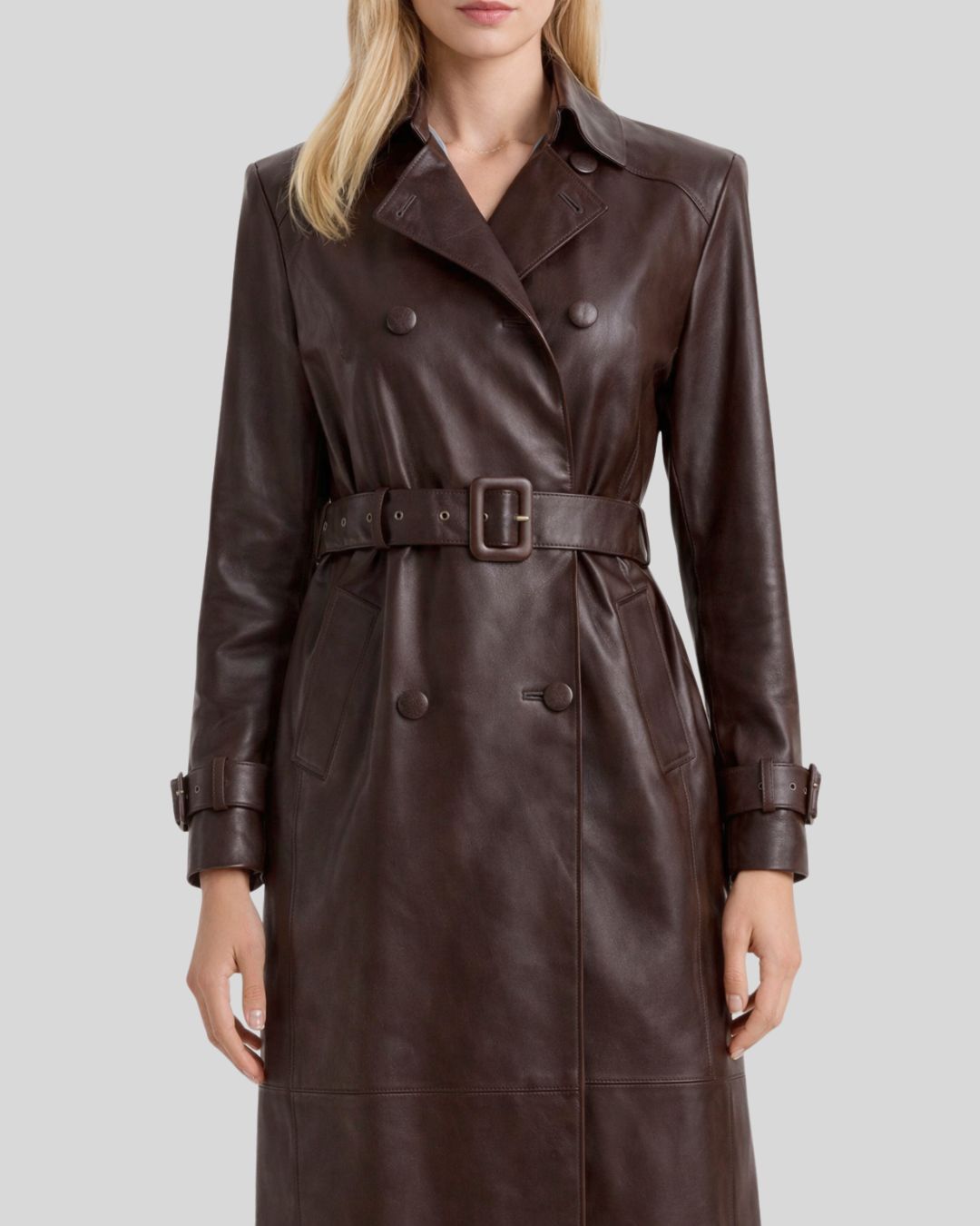 Close view of belted dark brown leather trench coat women