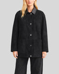 Front view of black button up suede jacket for women