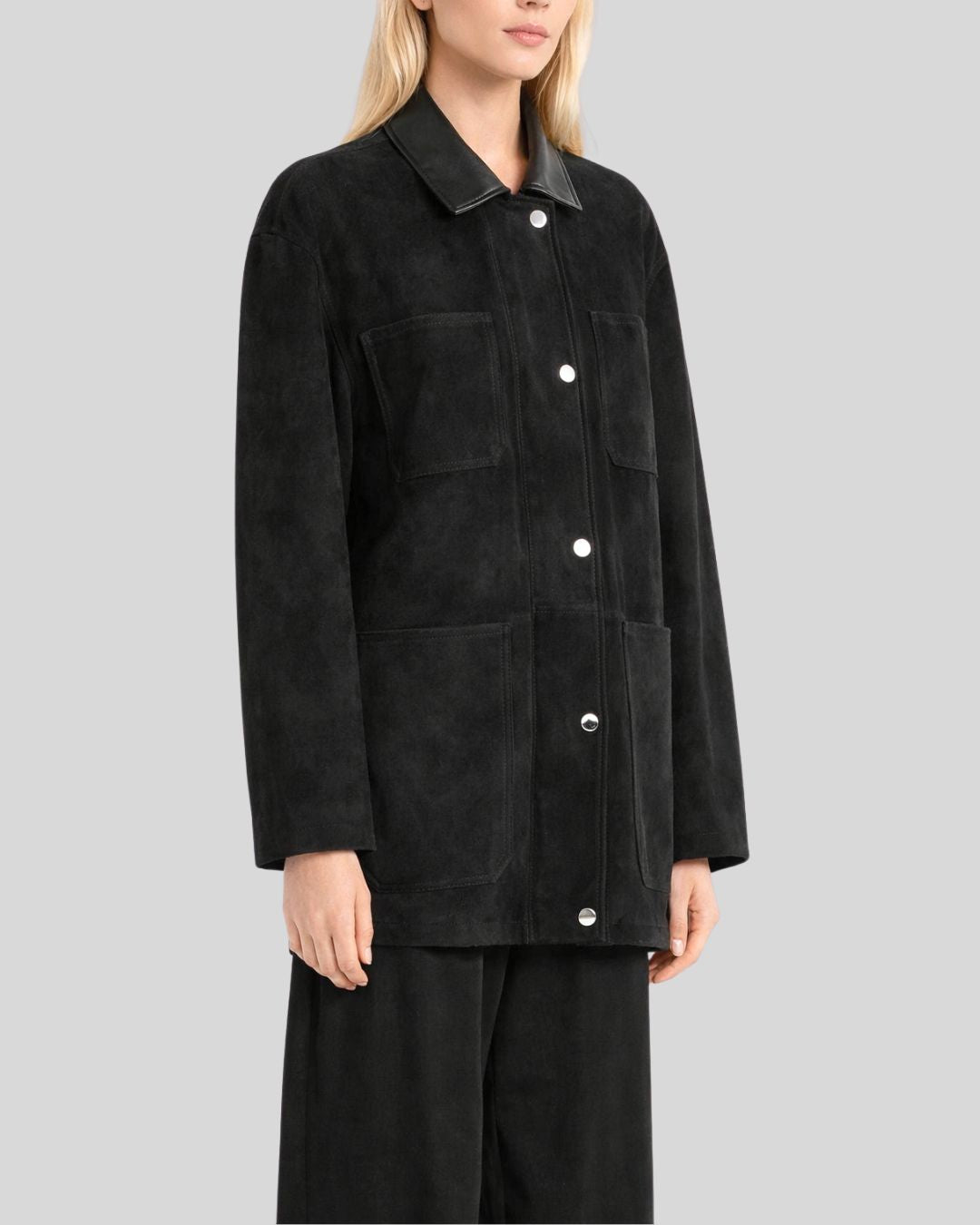 Angled view of women’s black suede button jacket