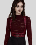 model wearing burgundy leather body harness with silver studs over distressed burgundy top