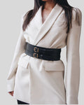 black leather waist belt layered over blazer styled in modern minimal look