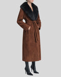 Side view of women’s brown suede coat with fur collar and pockets