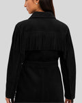  Back view of black suede women's jacket with long fringe and waist belt
