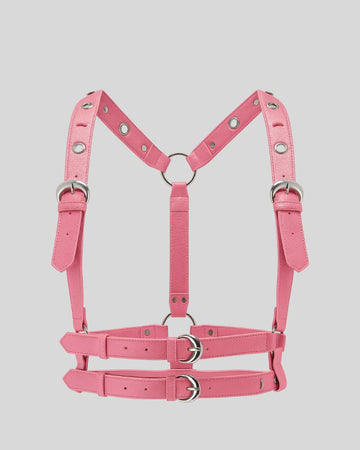 pink leather body harness laid flat with dual waist belts and silver O-rings