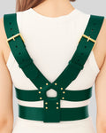 back view of green leather harness with gold rivets and Y-back design