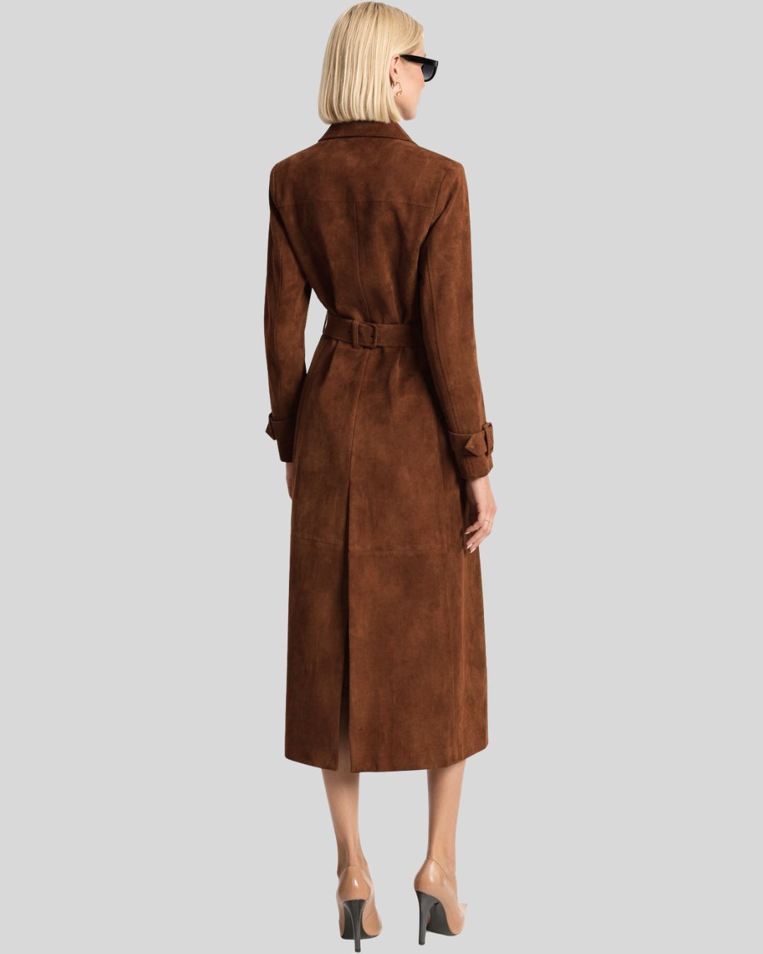 Front view of brown suede trench coat for women with double breasted design and belt