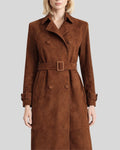 Close-up front view of women’s brown suede trench coat with button details