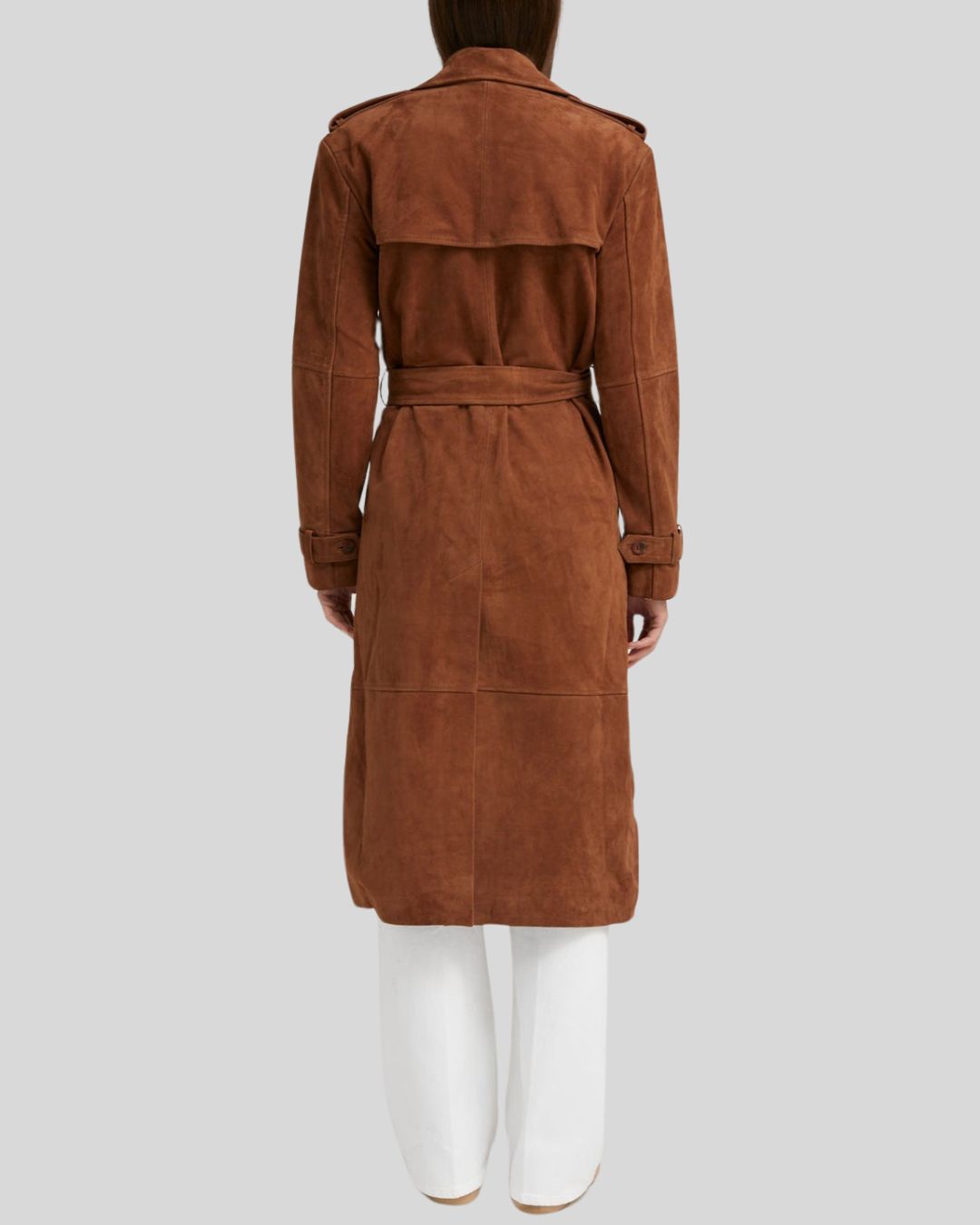  Woman in long chocolate brown suede trench coat open at front
