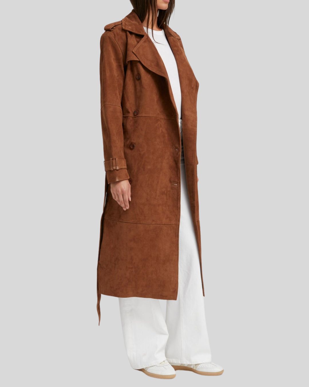  Side view of brown suede trench coat with belted cuffs
