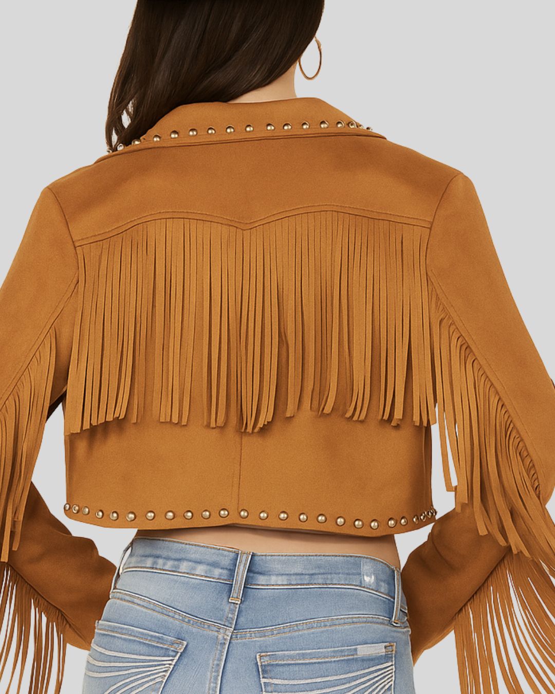 Close-up of fringe and studs on the back of cropped suede jacket