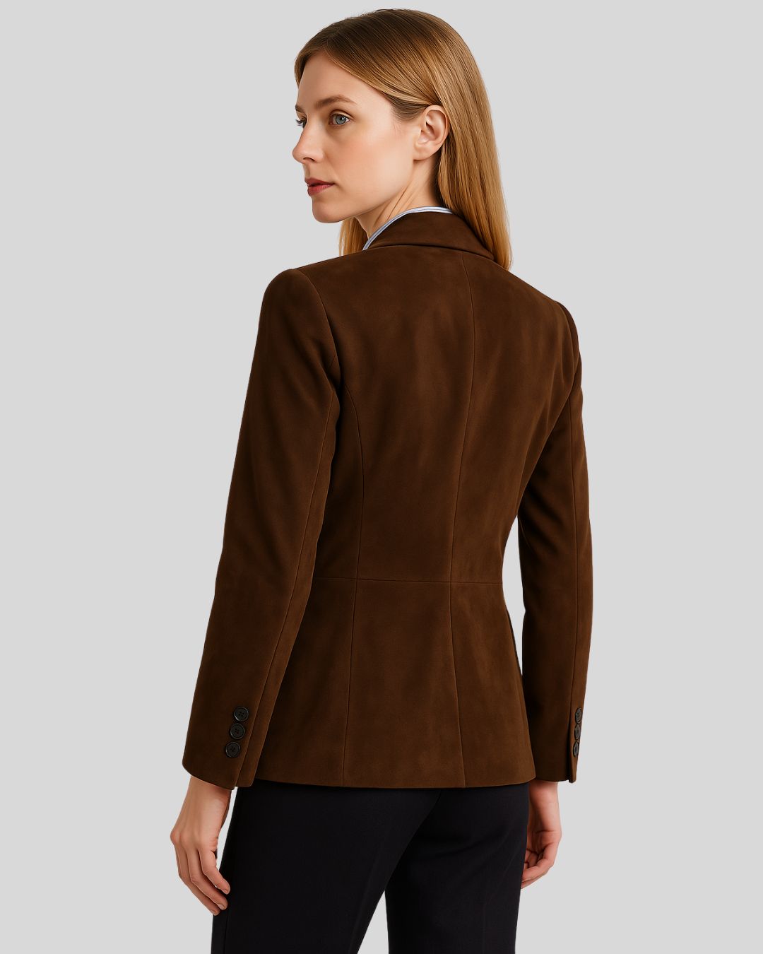  Model wearing brown suede blazer and pants with button closure
