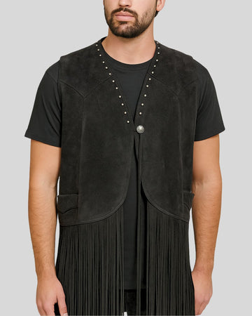 Model wearing black suede western fringe vest with stud details and concho button