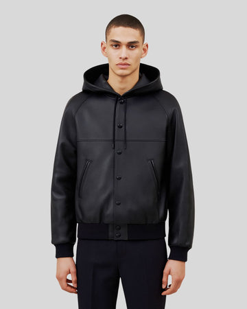 Front view of black leather bomber jacket with hood for men