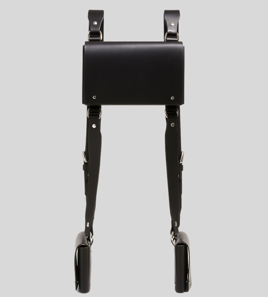 flat lay of leather shoulder harness holster with triple pouch