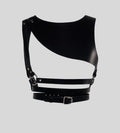  Flat lay of black asymmetrical leather body harness with silver hardware