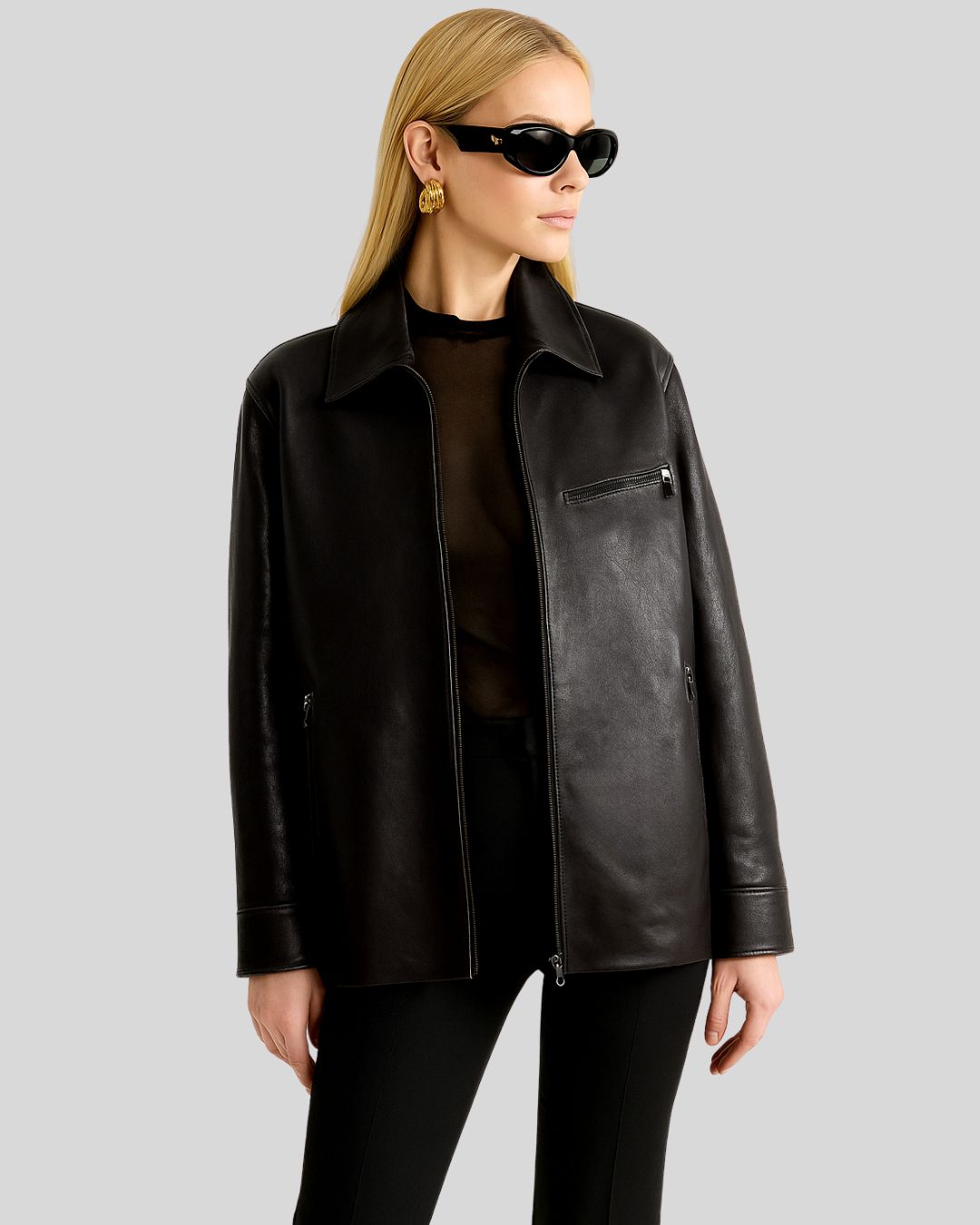 Black leather zip jacket for women with minimalist design and pointed collar