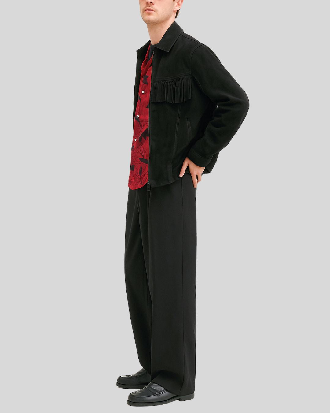 Man wearing black suede western fringe jacket with red shirt