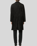 Back view of black suede long coat on model