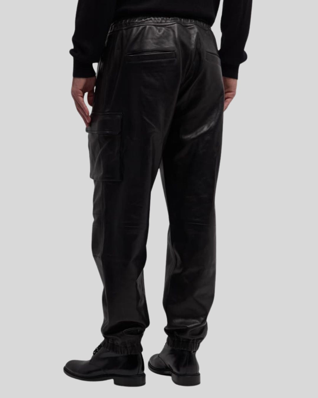 side angle view of black leather cargo pants – Blackout Jet