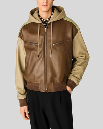 Front view of men's two-tone leather bomber jacket with hood
