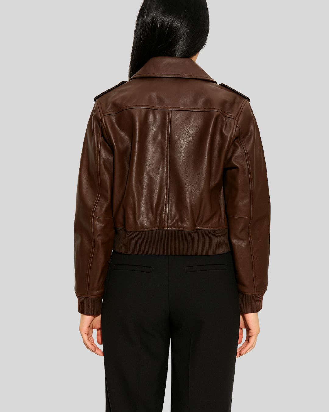 Brown leather bomber jacket for women with gold snap buttons – front view