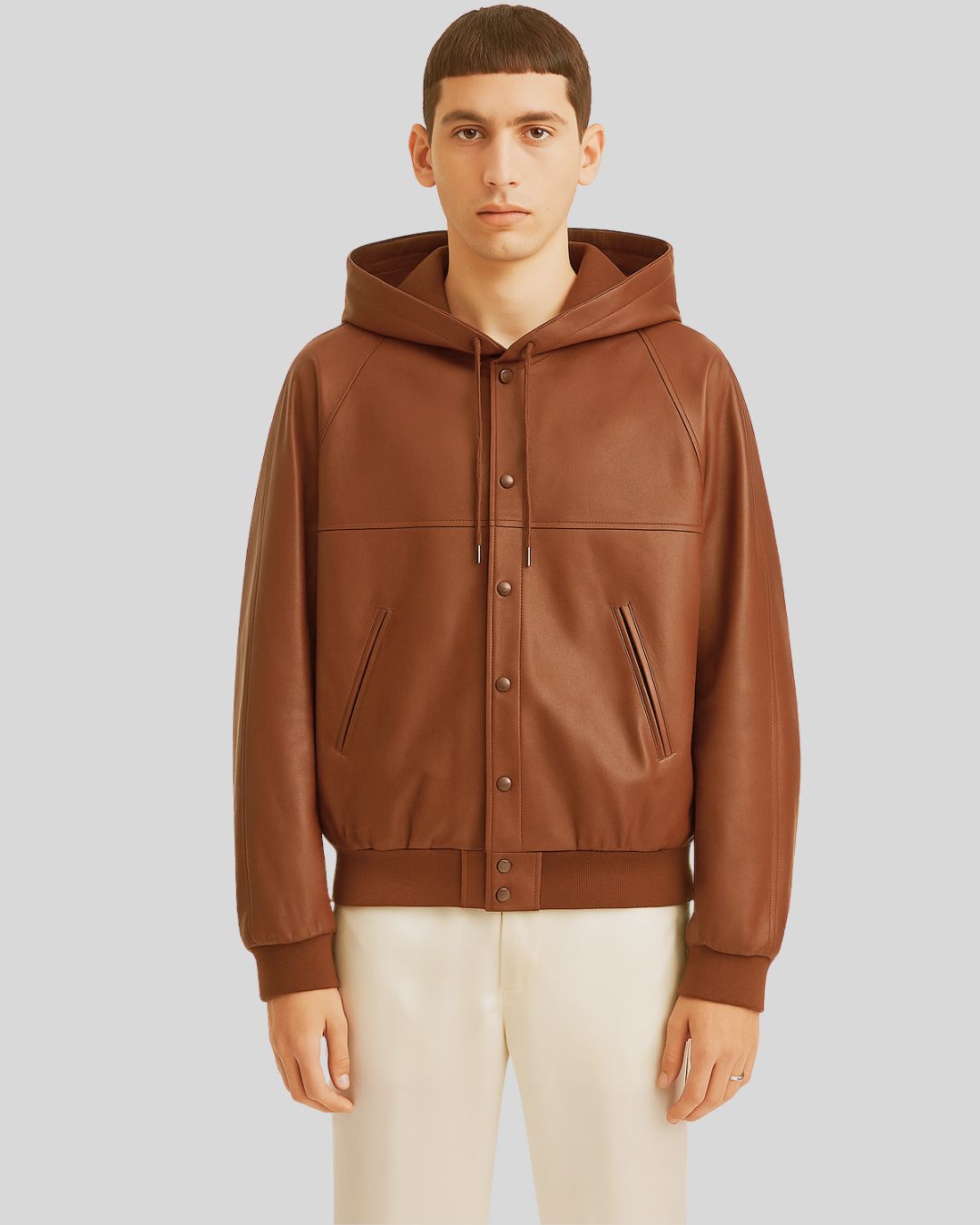 Front view of brown leather bomber jacket with hood for men