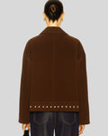 Brown jacket with studded details on a back plain background
