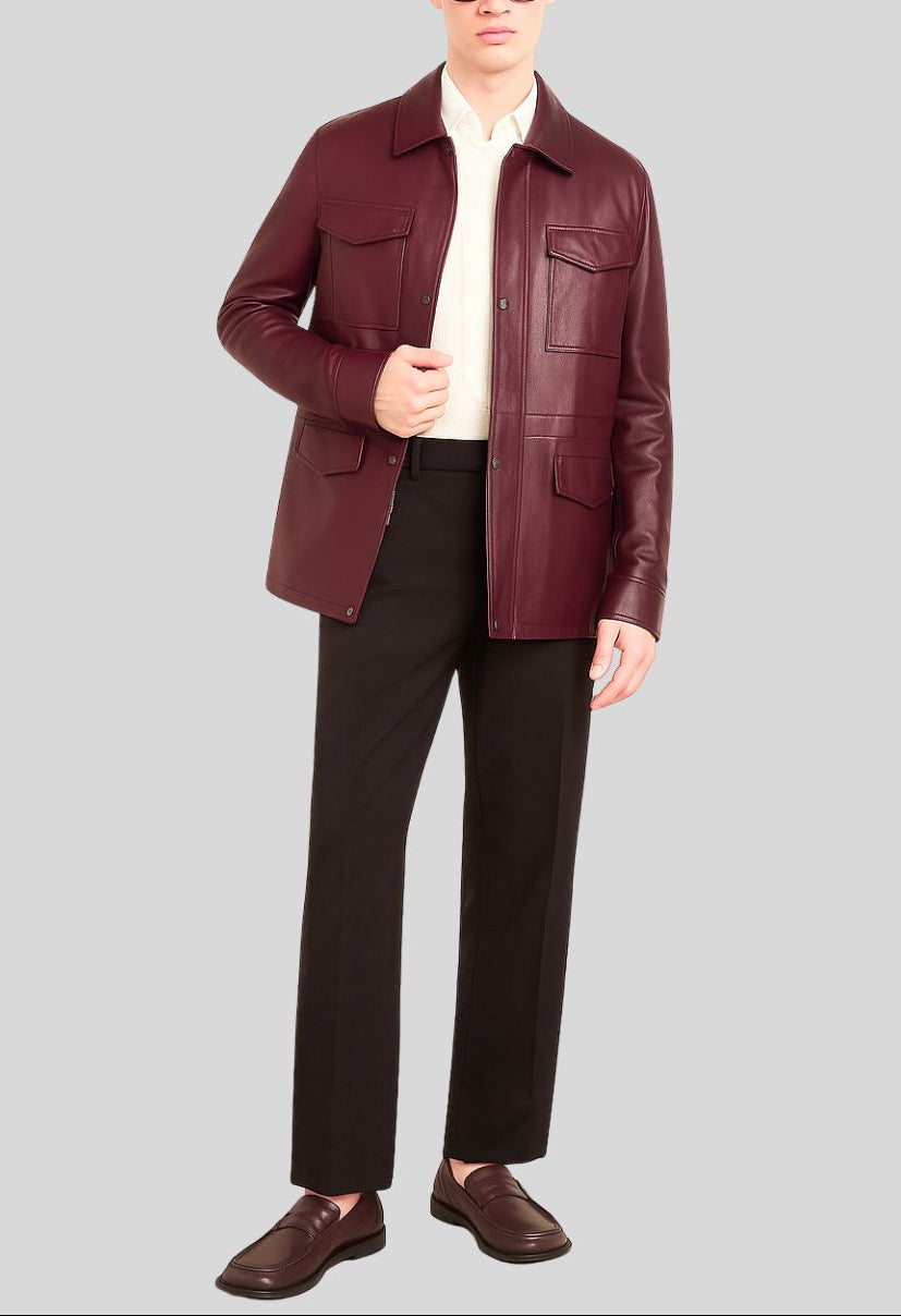 Burgundy leather jacket with hand in pocket close-up