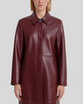 Burgundy leather coat close-up showing collar and concealed closure