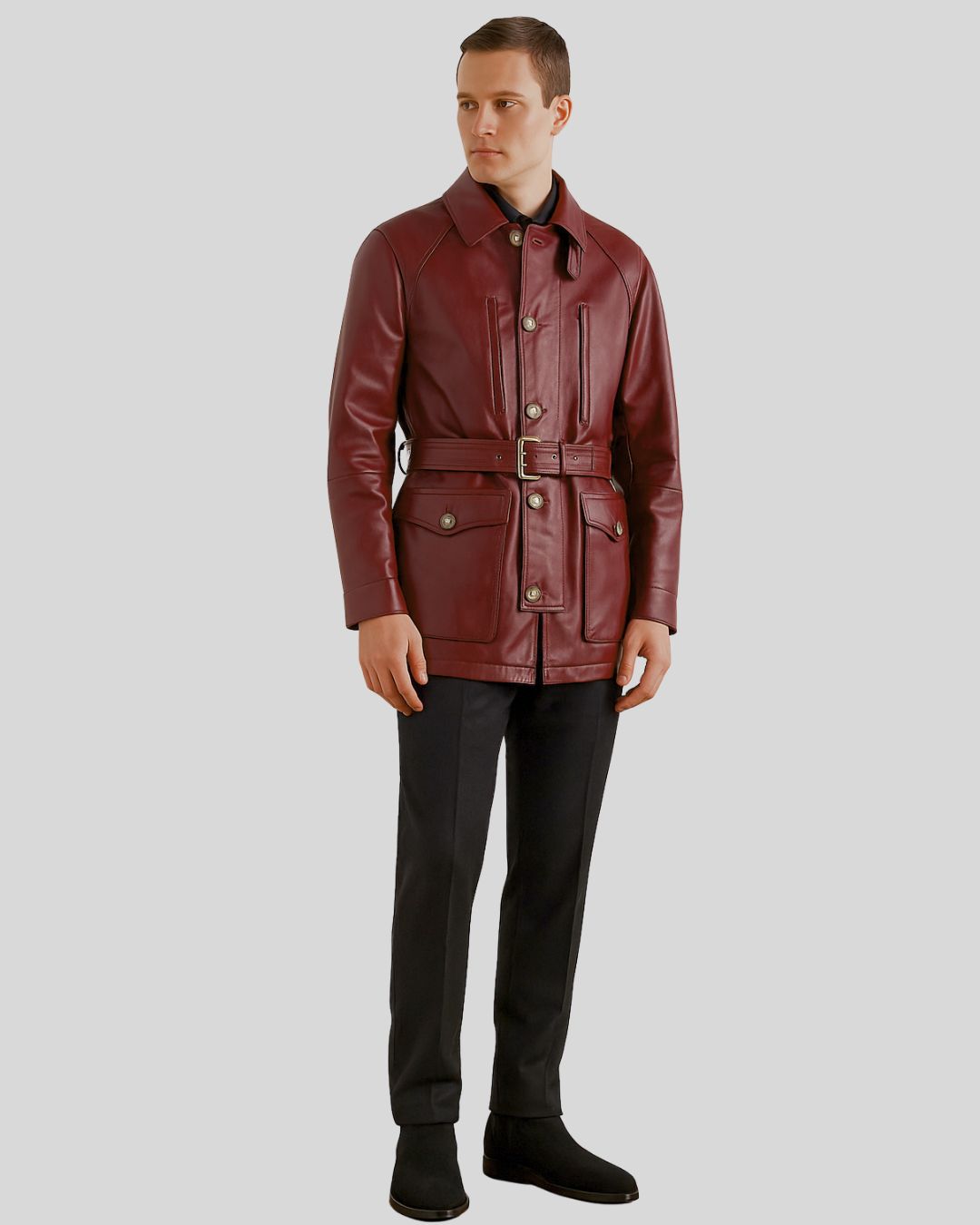 Full body view of burgundy safari coat styled with black trousers