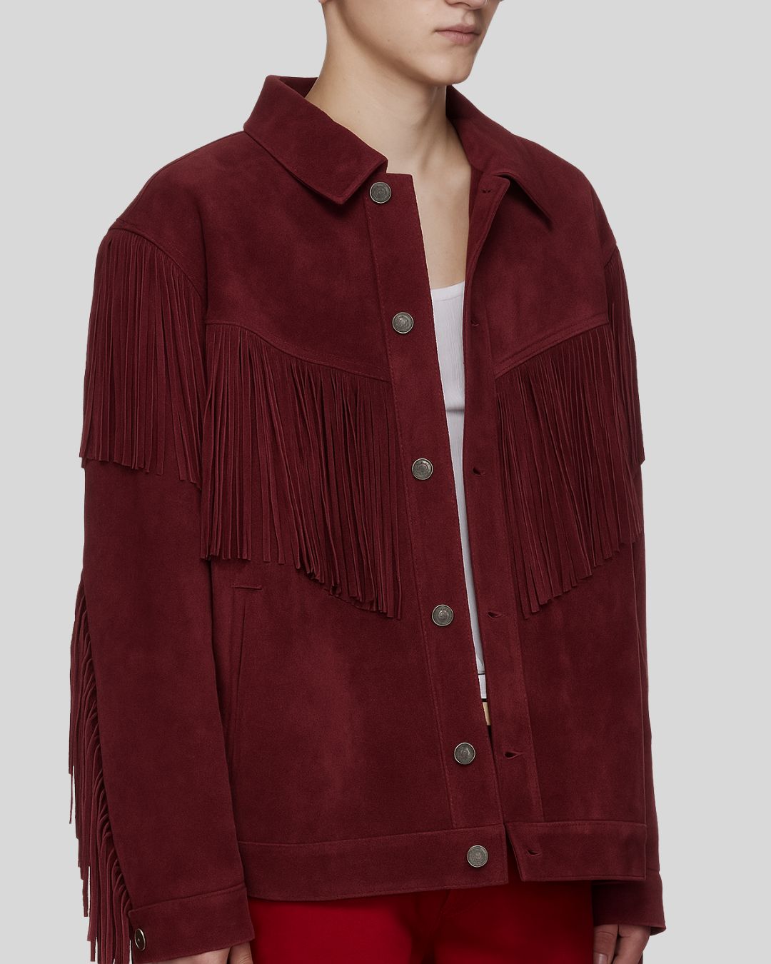 Side profile of burgundy fringe suede jacket – relaxed fit view