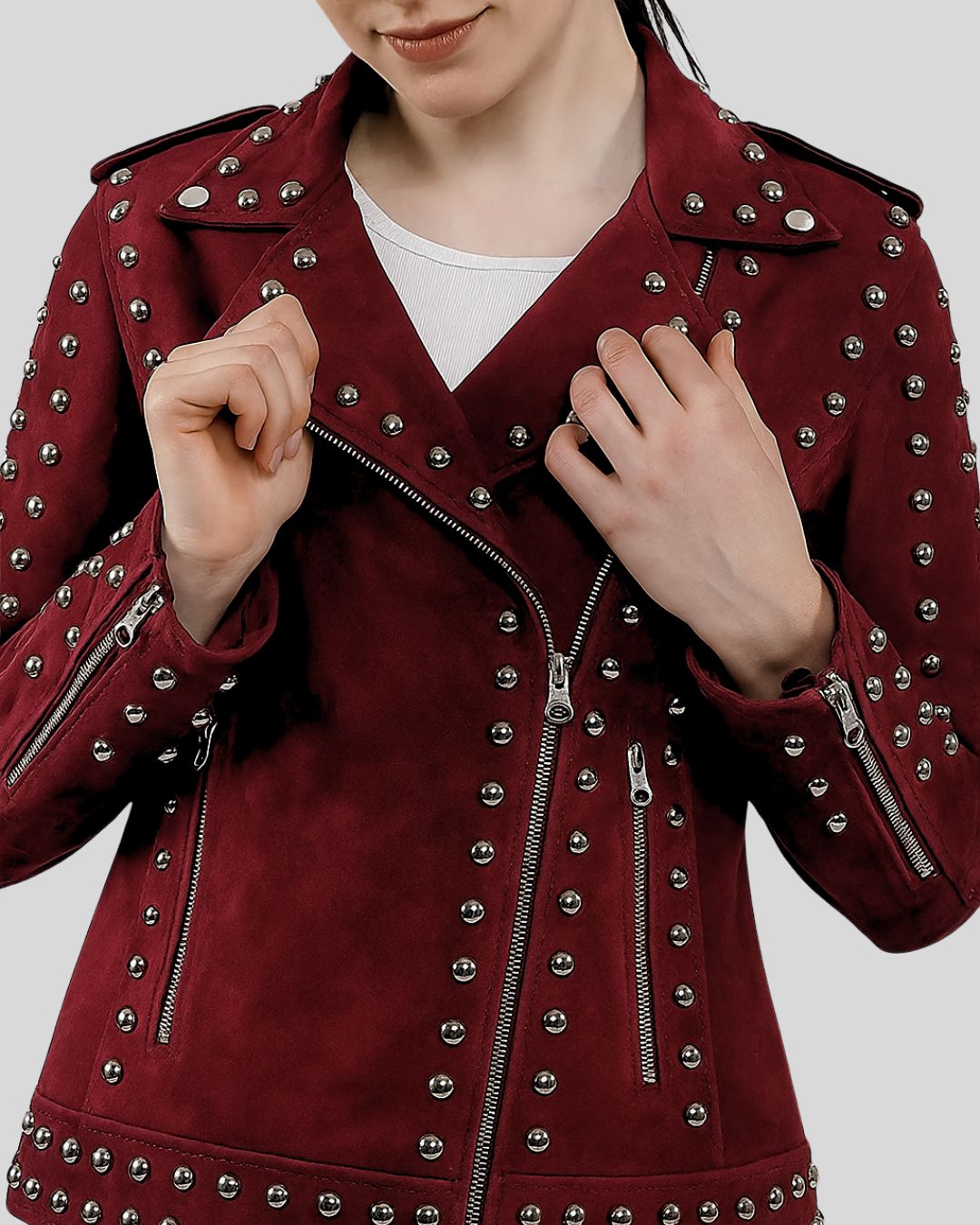Front view of burgundy suede biker jacket with silver studs and asymmetric zip