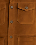 close-up button and pocket detail of suede vest