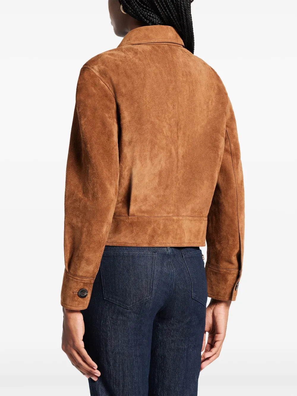 Back view of woman in cropped suede jacket