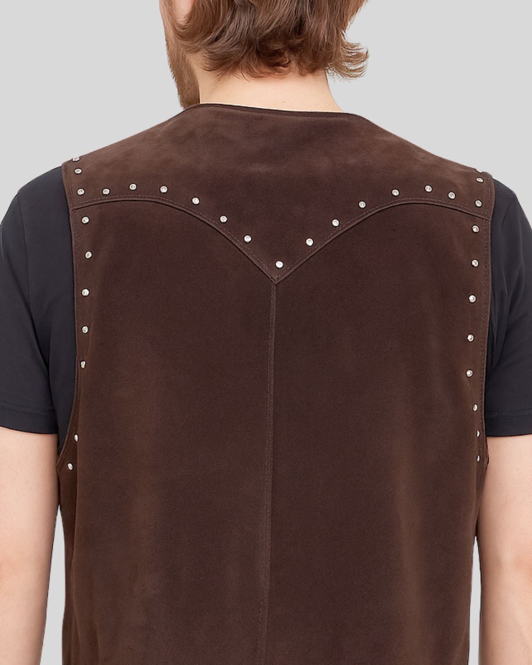 Close-up of the back yoke and studs on suede fringe vest
