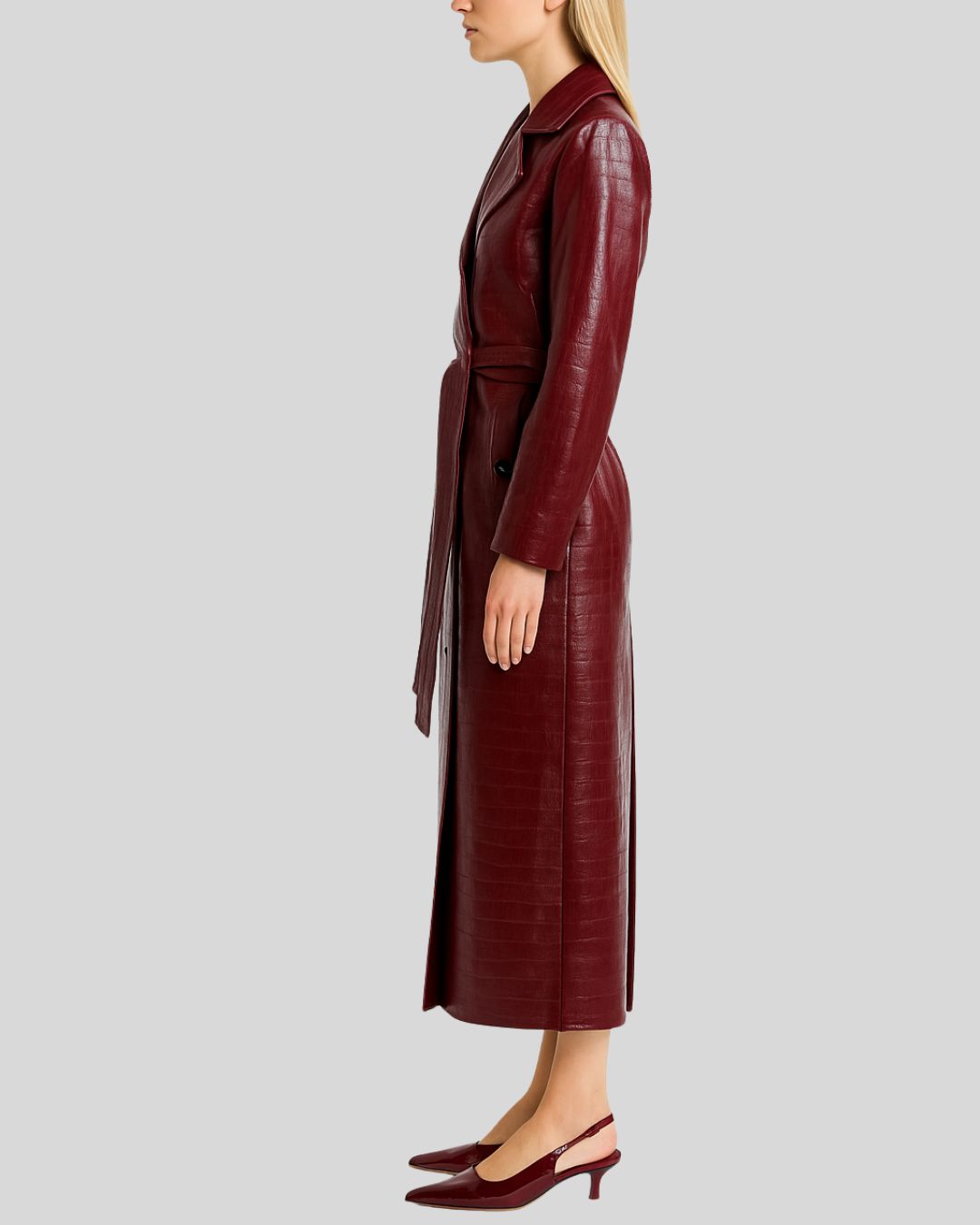 Side profile of croc embossed burgundy leather trench coat