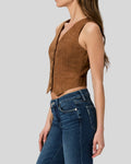  Side view of woman in brown suede fitted vest with tailored cut

