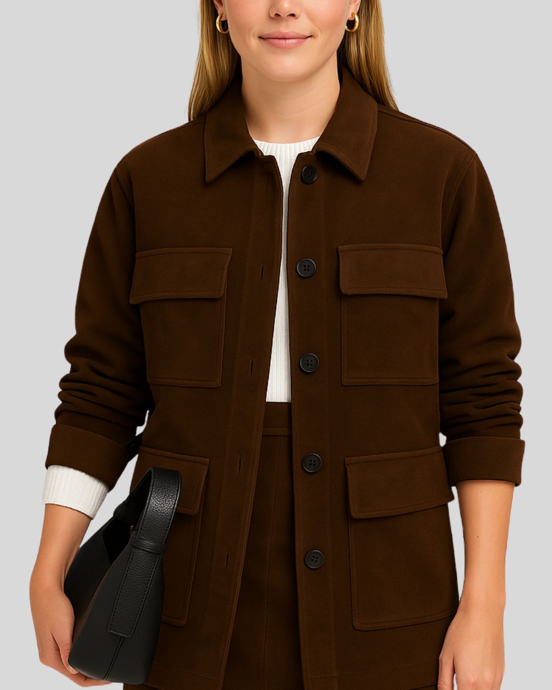  Front view of a women's dark brown suede field jacket with four pockets
