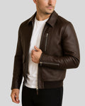 Close-up angle of brown leather bomber chest and zipper