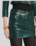 belted leather mini skirt styled with tights and heels