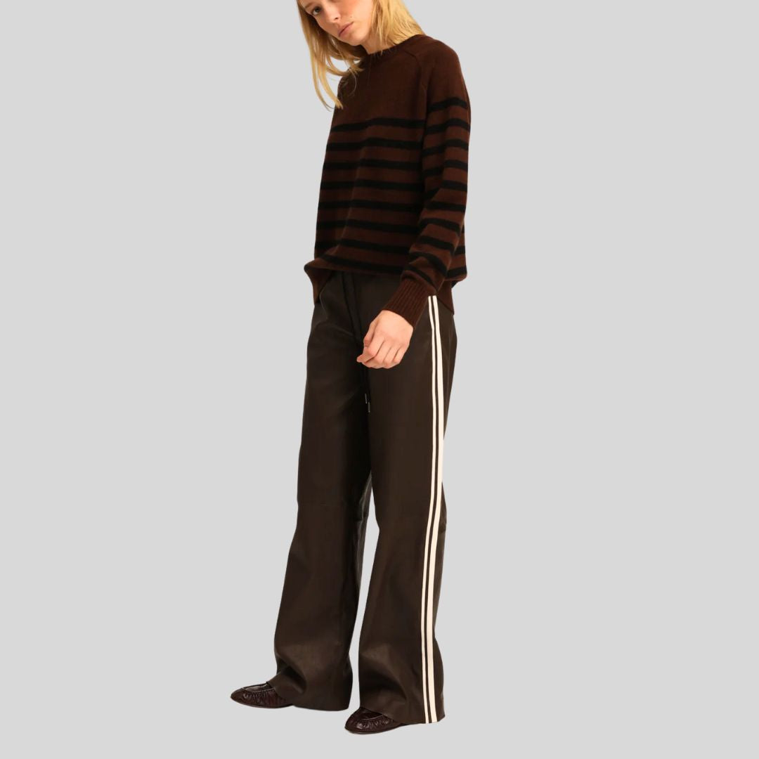 side view of Espresso Stride brown leather pants with stripe detail