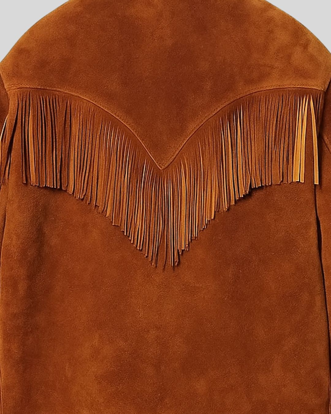 Fringe detail zoomed in on back yoke of suede men’s jacket