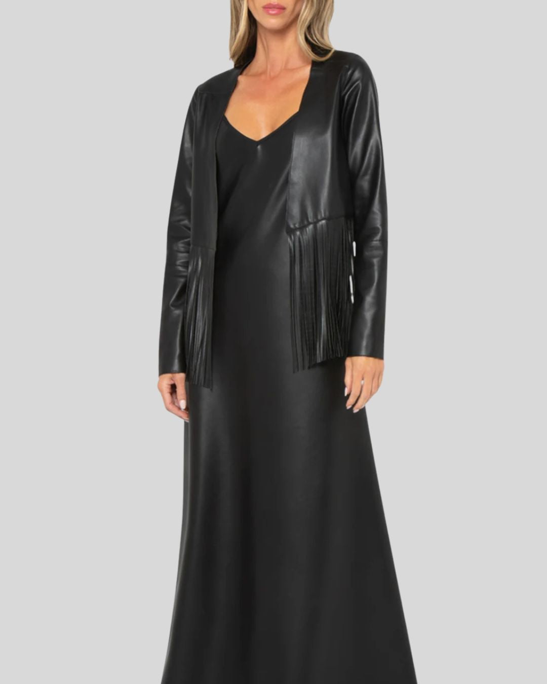  Full-length black leather fringe jacket paired with slip dress
