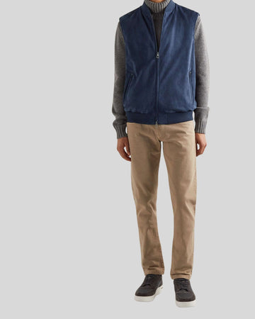 model wearing Navy Loft blue suede vest with beige pants