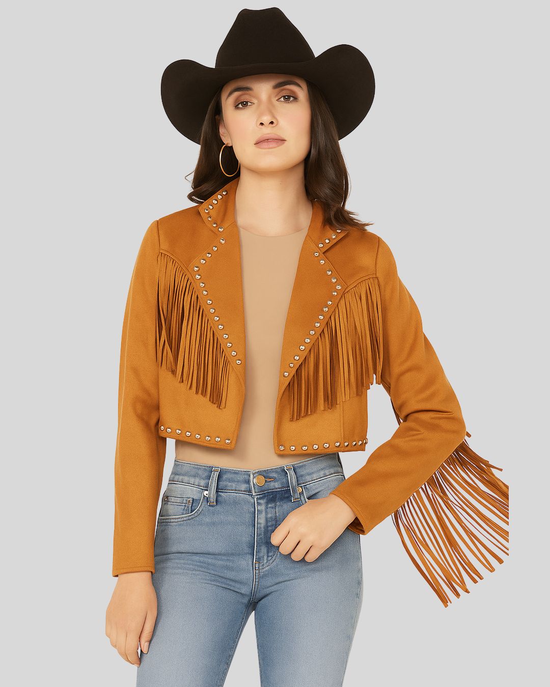 Model wearing cropped suede western jacket with fringe and jeans