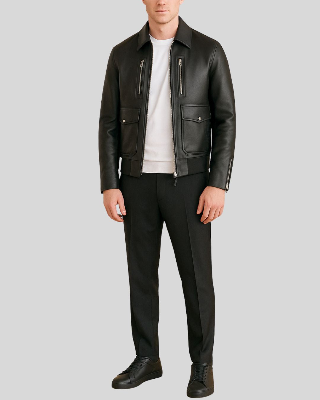 Model wearing black leather utility bomber jacket and pants