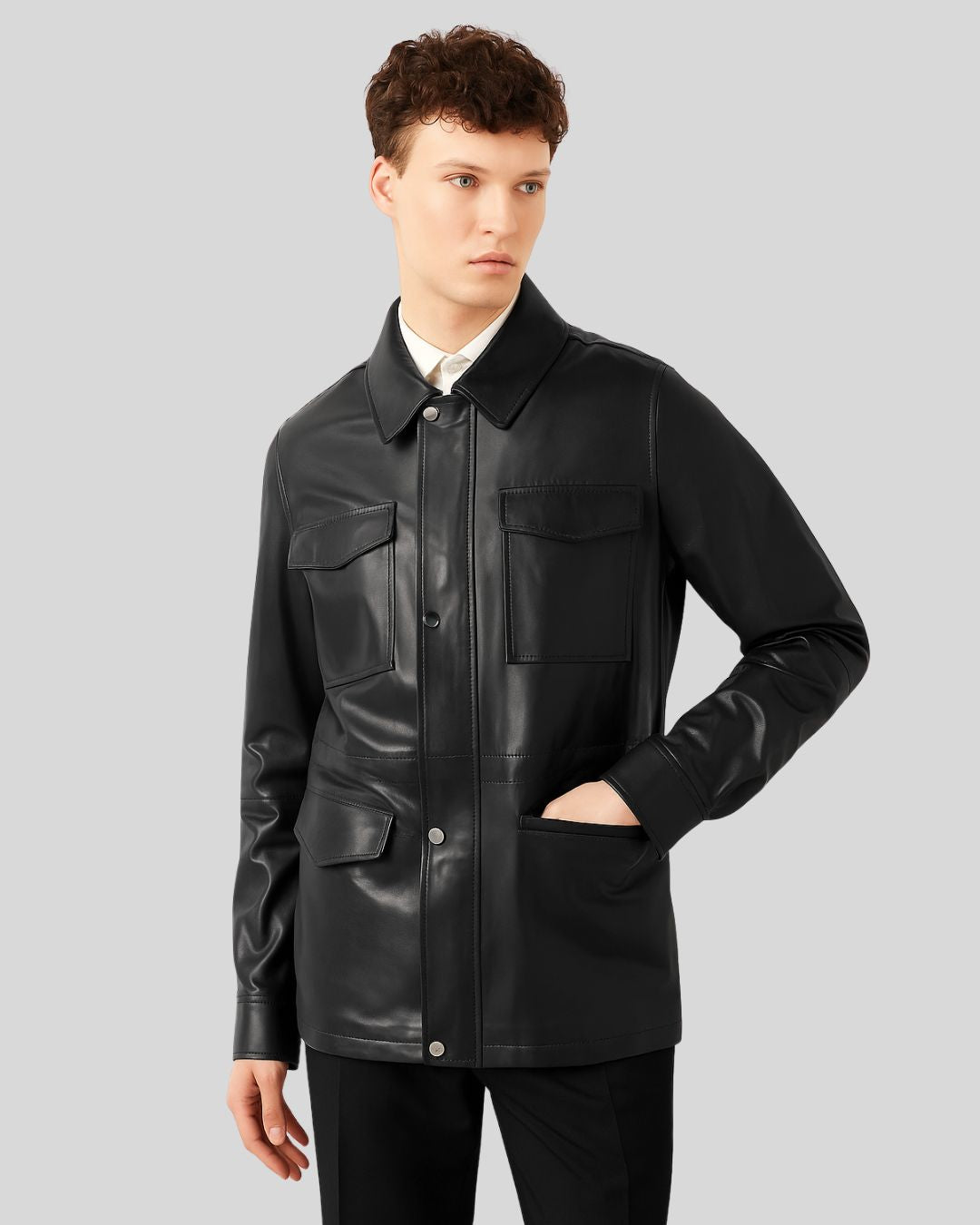 Male model with hand in pocket wearing black leather jacket