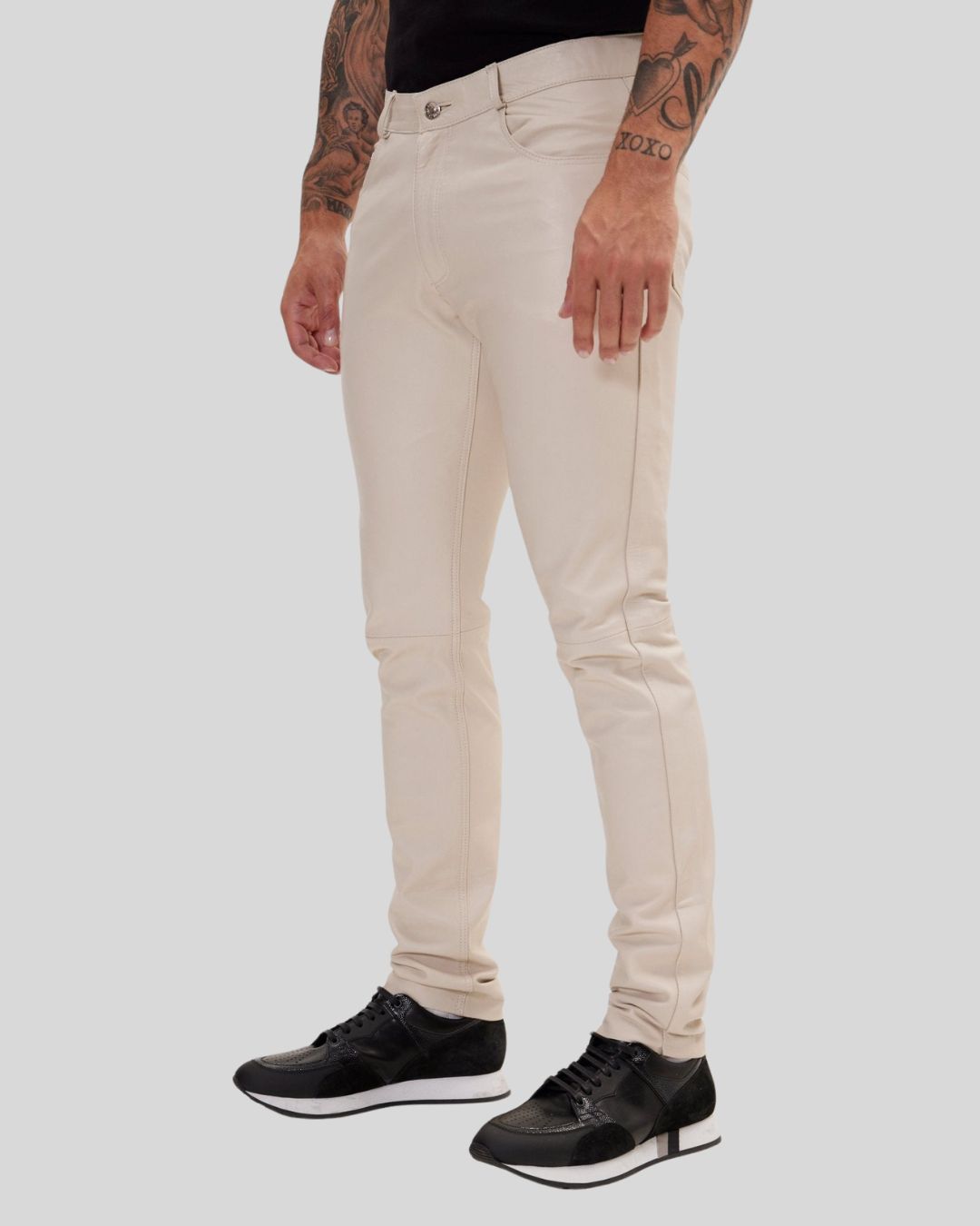 side angle of ivory leather straight pants